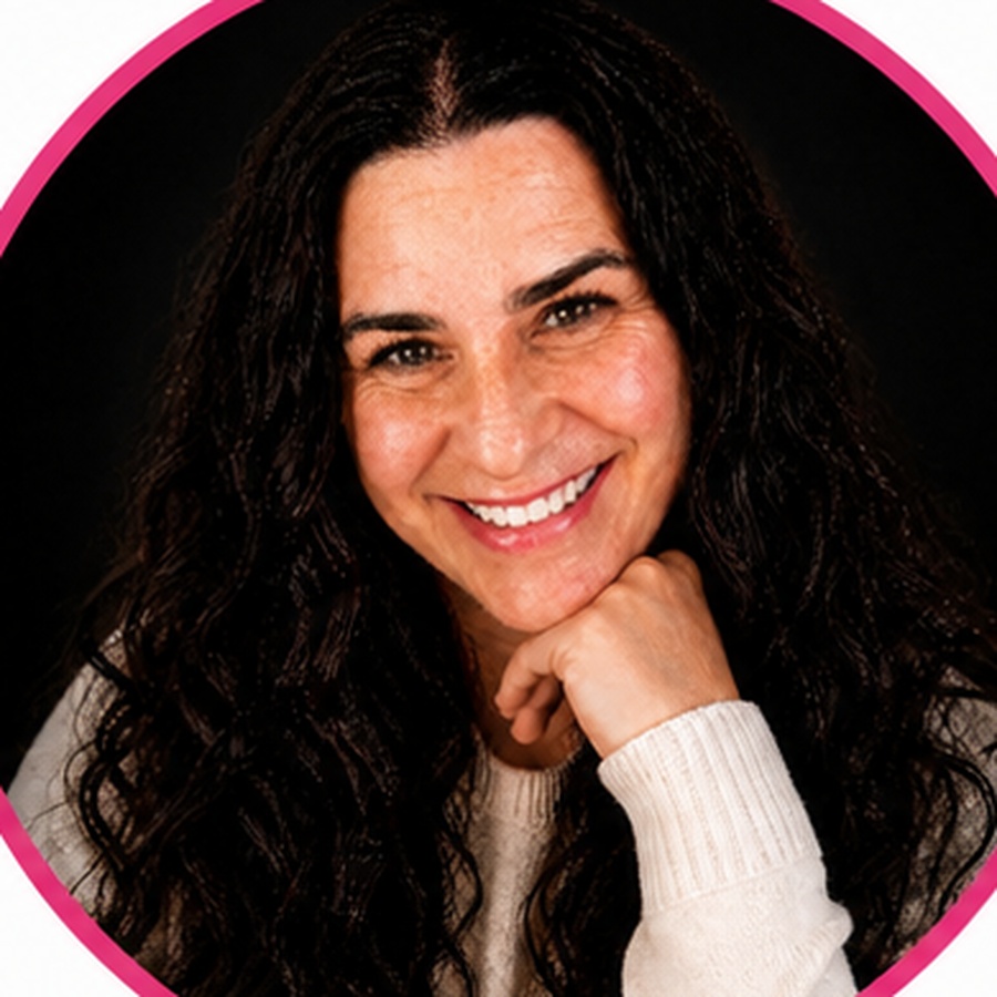 Randi, founder of Fortunate Virtual Solutions, smiling in a white sweater